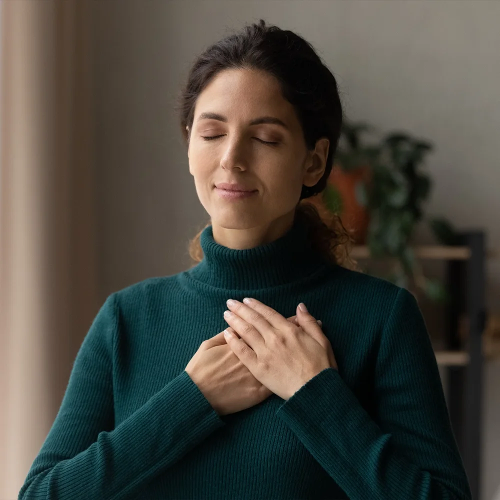 A woman looking calm and content at home